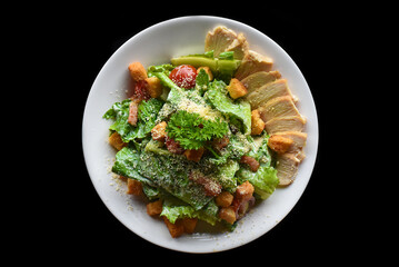 Caesar salad served in Vietnamese style on black background top view