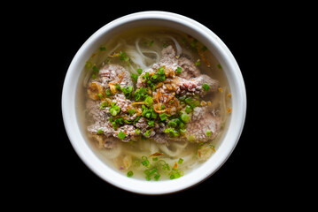 Traditional vietnamese soup Pho bo on black background