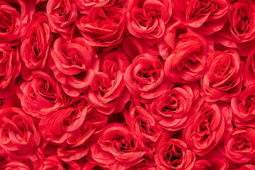 artificial Rose flowers. Party Textil wreath. Festival Wedding Background Celebrate red flowers...