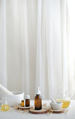 luxury skincare and spa background with copy space. The natural dropper glass container with essential oil on white lavish background.