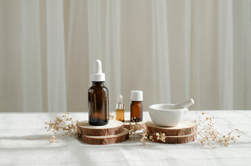 Fototapeta na wymiar wellness and spa background. The aromatherapy bottle with luxury wooden decoration.