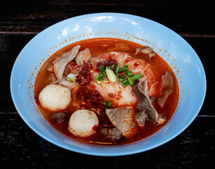 Pork meatball noodles, Tom Yum pork, spicy Thai food.