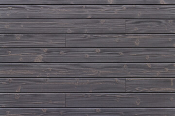 Obraz premium 焦げ茶色の木目の壁、背景素材