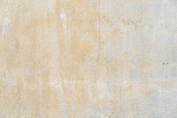 old yellow dirty scratched cement wall or ancient brown rust stains and rough concrete table on top...