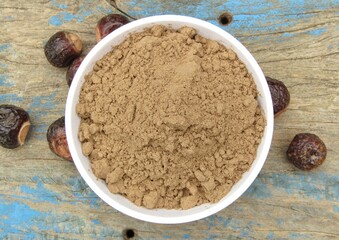 Sapindus mukorossi powder in a bowl 