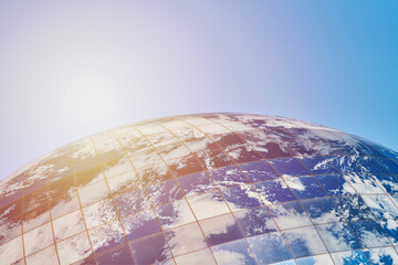 Earth planet modern building with clouds and blue sky in sunlight, ecological architectural...