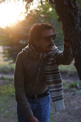 man wearing glasses under the roof of sun