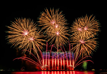 Firework display at night on isolated black background at Pattaya City.