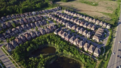 Panoramic view at established neighbourhood with town home cottage style houses in Canada. Top...