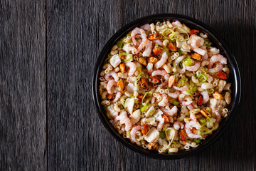 macaroni salad with shrimps, mussels, fish, leek
