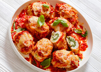 tasty chicken rollatini in tomato sauce, top view