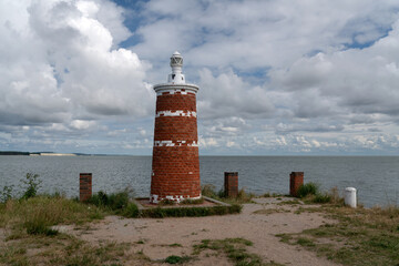 Lighthouse in the village of Rybachy on a sunny summer day, Curonian Spit, Kaliningrad region,...