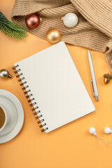 Christmas background with blank notebook, coffee, christmas decorations. Space for text.