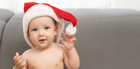 Christmas little baby boy, baby in santa hat.