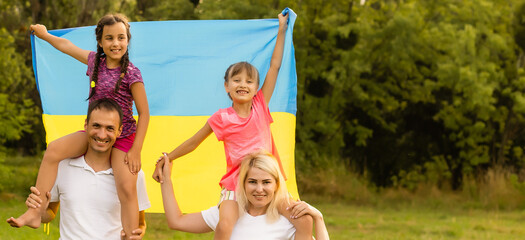 Ukraine's Independence Flag Day. Constitution day. family with the flag of ukraine in field. 24 August. Patriotic holiday.