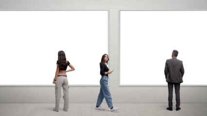 People looking at paintings at the art exhibition