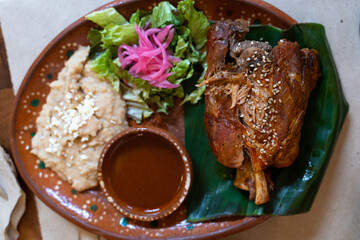 Roasted lamb, salad, mashed potatoes and spicy sauce dip. Traditional Mexican combo plate