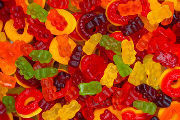 Assorted colorful gummy candies. Jelly donuts. Jelly bears.