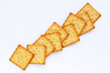 Dry cracker cookies on white background.