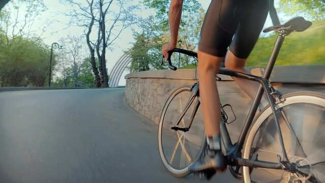Cyclist training leisure twists pedals on triathlon bicycle