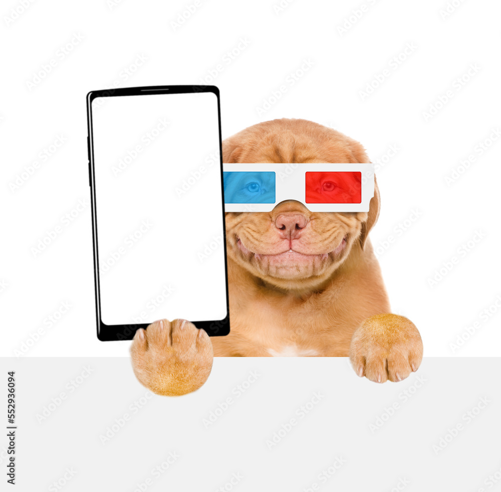 Aufkleber smiling mastiff puppy wearing 3d glasses holds big smartphone with white blank screen in it paw, sho