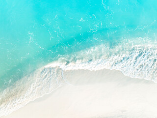 White sand beach with wave water in the seashore as ecology background