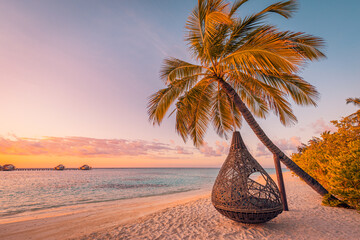 Romantic beach palm tree swing. Summer amazing travel landscape, couple destination scenic. Sandy island shore, exotic sunset sky. Colorful vacation honeymoon background. Beautiful panoramic tropics
