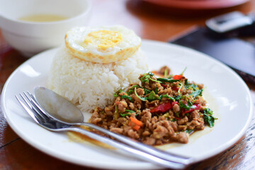 close up thai food, minced pork stir-fry with fried egg