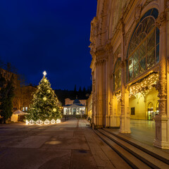 Decorated main colonnade at Advent time with Christmas tree - evening photography of Czech spa town Marianske Lazne (Marienbad) - Czech Republic, Europe