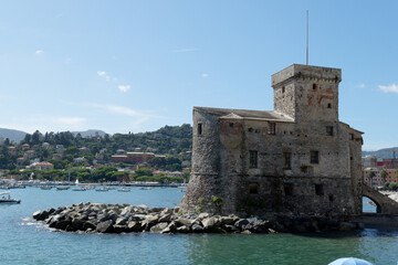 Fototapeta na wymiar View of the Rapallo castle from the bay on the Tigullio gulf . Liguria, Italy