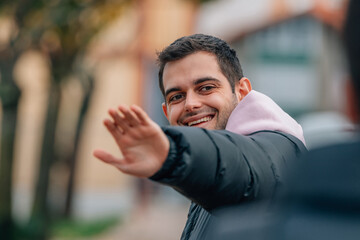 friends greeting each other on the street