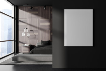 Front view on dark bedroom interior with empty white poster