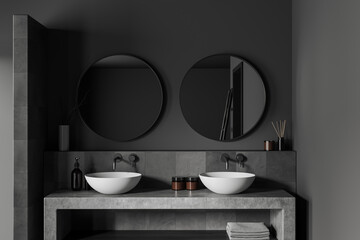 Front view on dark bathroom interior with double sink