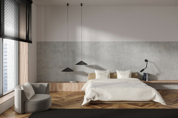 Fototapeta na wymiar Light bedroom interior with bed and armchair near panoramic window. Empty wall