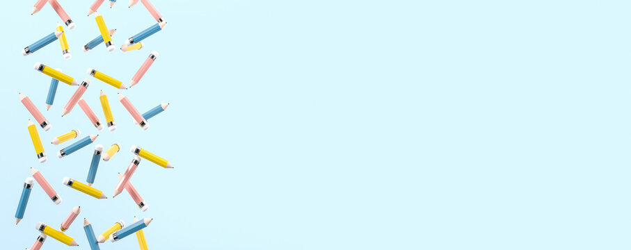 Colorful different pencils falling, empty copy space