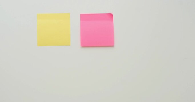 Six multi-colored note paper on a white background. Looped 4K stop motion animation
