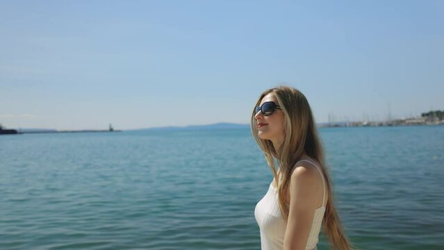 Woman walking along the Riva Promenade, Split, Croatia