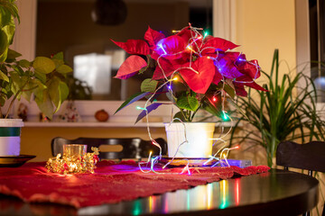 Festive table with flowers and lights. Christmas lights