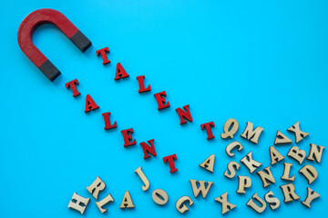 Talent management concept. The magnet attracts the word talent.