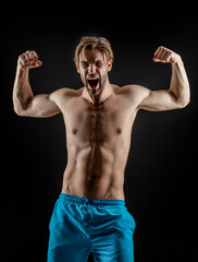 Fototapeta na wymiar shouting muscular man with strong hands. photo of strong man shout. strong muscular man