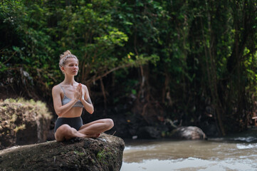 Girl practice yoga meditation outdoor in park