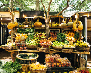 Local outdoor market. Fruits and vegetables in baskets and boxes.