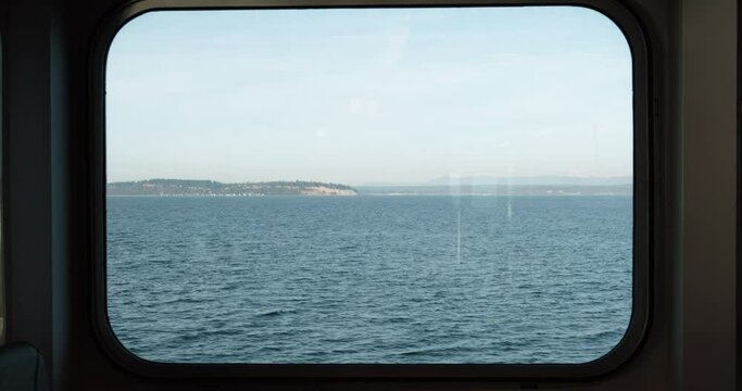 Looking Out Ferry Boat Window View of Ocean Islands