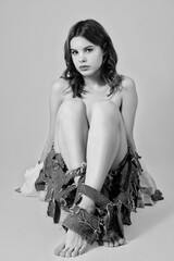 woman in torn jeans