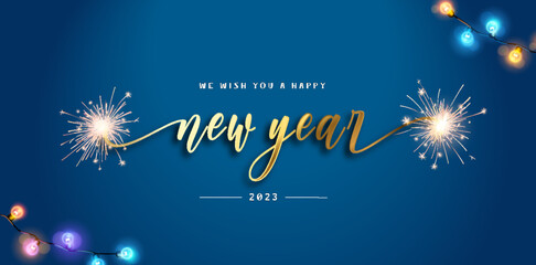 We wish you a Happy New Year 2023 ribbon shape handwritten calligraphy lettering sparkle firework for 2023 gold blue background banner