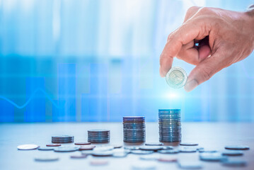 Hand man putting coin stack, Money saving concept