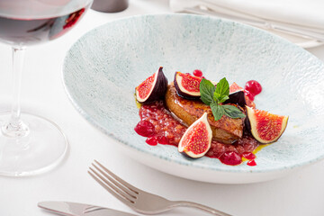 .Add to Likebox.Preview.Share.Rose roasted duck with fig and drops of red wine sauce on a white plate