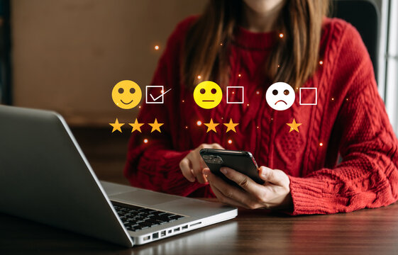 Smart woman use smartphone and tablet choosing happy smile face icon. feedback rating and positive customer review experience, mental health assessment.