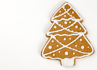 Christmas cookies. Gingerbread tree on a white background, with space for text.