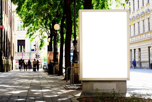 Billboard At Busstop. Blank White Poster And Advertiser Ad Space. Digital Outdoor Display Lightbox. Base For Mockup. Empty Display Panel. Glass Design. Soft Streetscape. Urban Background